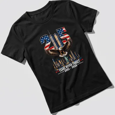 Vintage patriotic T-shirt featuring an eagle, Statue of Liberty, and skyline with commemorative text — printed on a women's shirt
