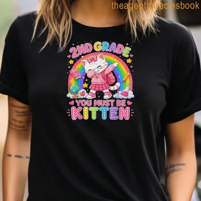 Kawaii-style T-shirt featuring a cute cat with a backpack and colorful text. — printed on a women's t-shirt