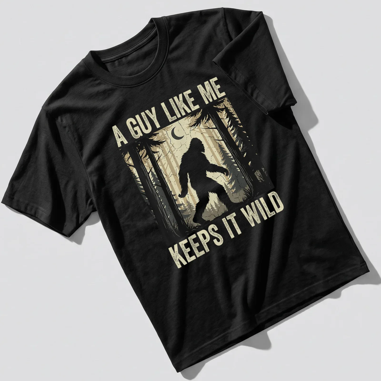 Vintage distressed Bigfoot graphic tee with humorous text about wild living — printed on a unisex t-shirt