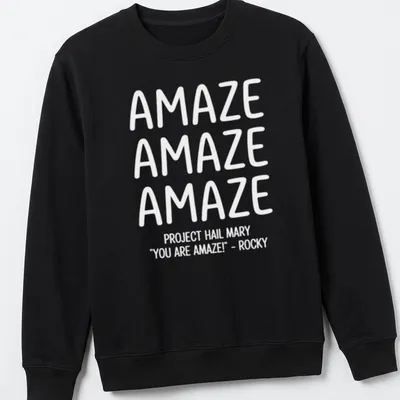 Bold typography t-shirt featuring repeated text 'AMAZE' in white — printed on a unisex sweatshirt
