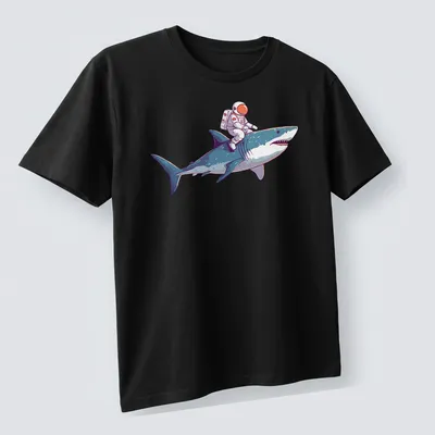 Playful cartoon of an astronaut riding a shark in vibrant colors — printed on a unisex t-shirt (angled view)