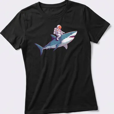 Playful cartoon of an astronaut riding a shark in vibrant colors — printed on a women's shirt