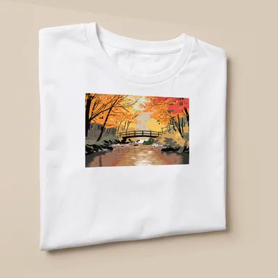Illustrative print of a troll by a bridge in autumn colors — printed on a unisex t-shirt (angled view)