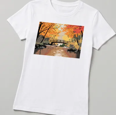 Illustrative print of a troll by a bridge in autumn colors — printed on a women's shirt