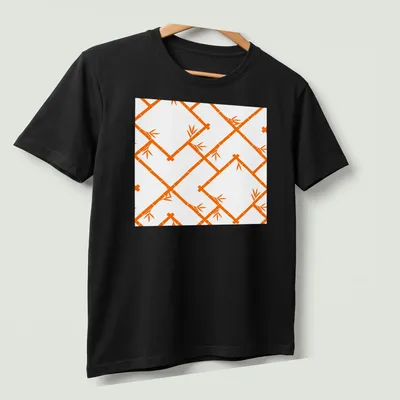 Modern chinoiserie bamboo lattice pattern in orange and white — printed on a unisex t-shirt (angled view)