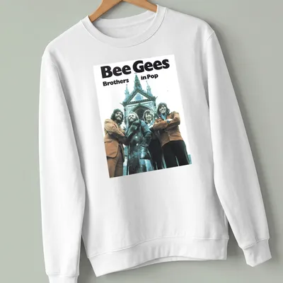 Vintage style shirt featuring the Bee Gees and the text Brothers in Pop in blue, brown, white, and black. — printed on a unisex sweatshirt