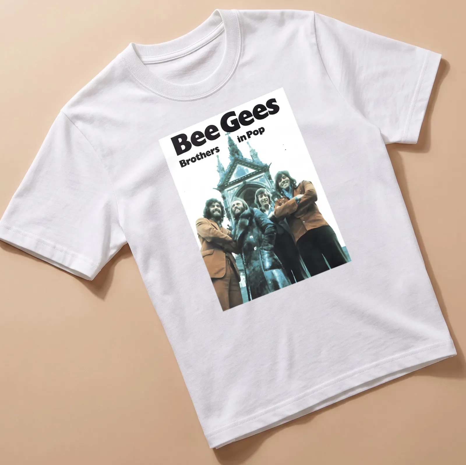 Vintage style shirt featuring the Bee Gees and the text Brothers in Pop in blue, brown, white, and black. — printed on a unisex t-shirt