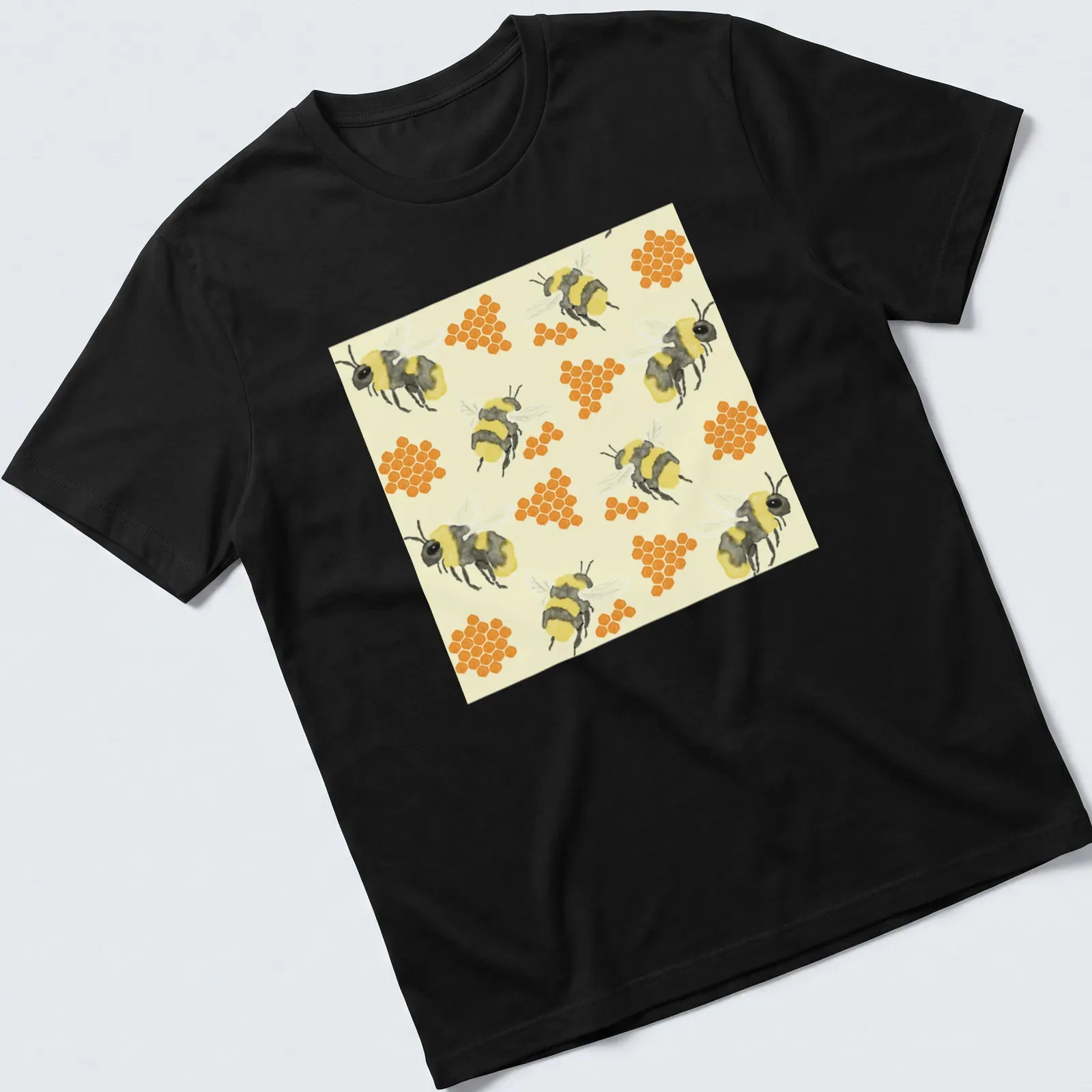 Watercolor print featuring bees and honeycombs in vibrant colors. — printed on a unisex t-shirt