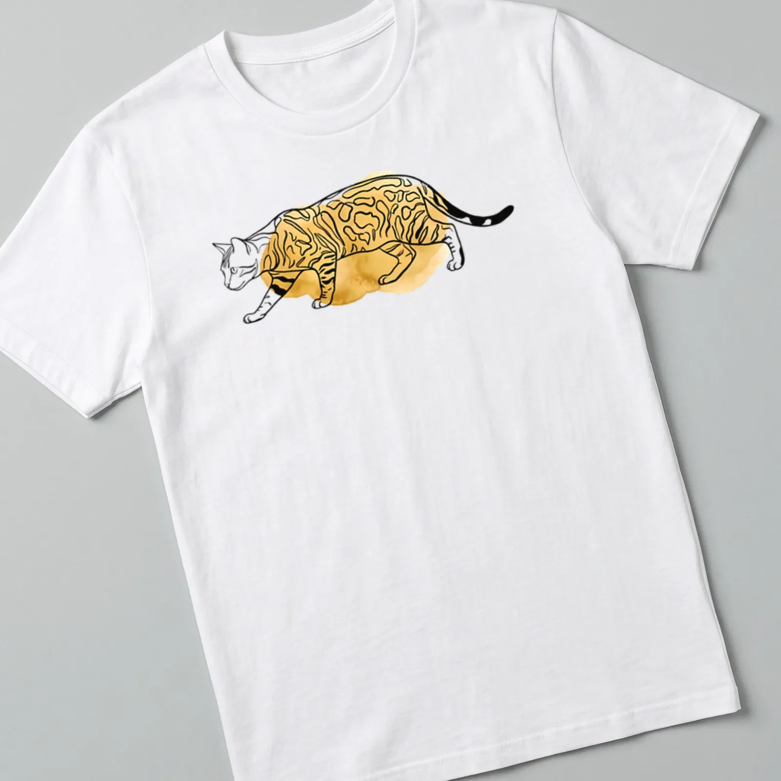 Boho line art illustration of a Bengal cat with spotted fur in gold and black — printed on a unisex t-shirt