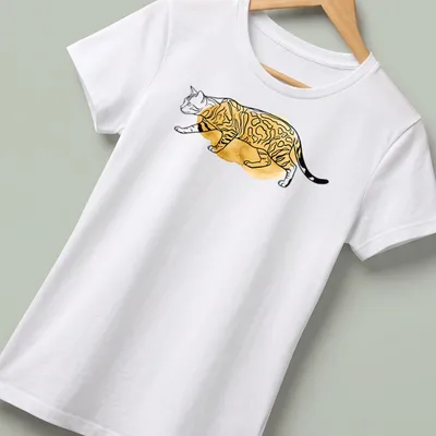 Boho line art illustration of a Bengal cat with spotted fur in gold and black — printed on a women's shirt