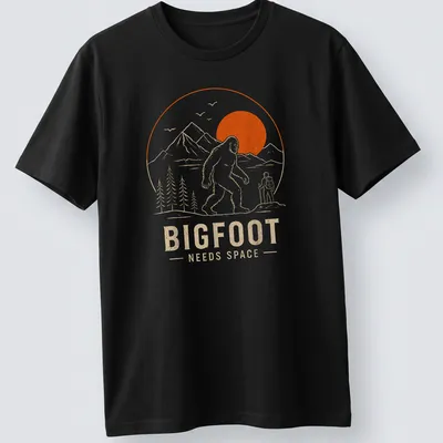 Line art design of Bigfoot with the text Bigfoot Needs Space in orange and beige