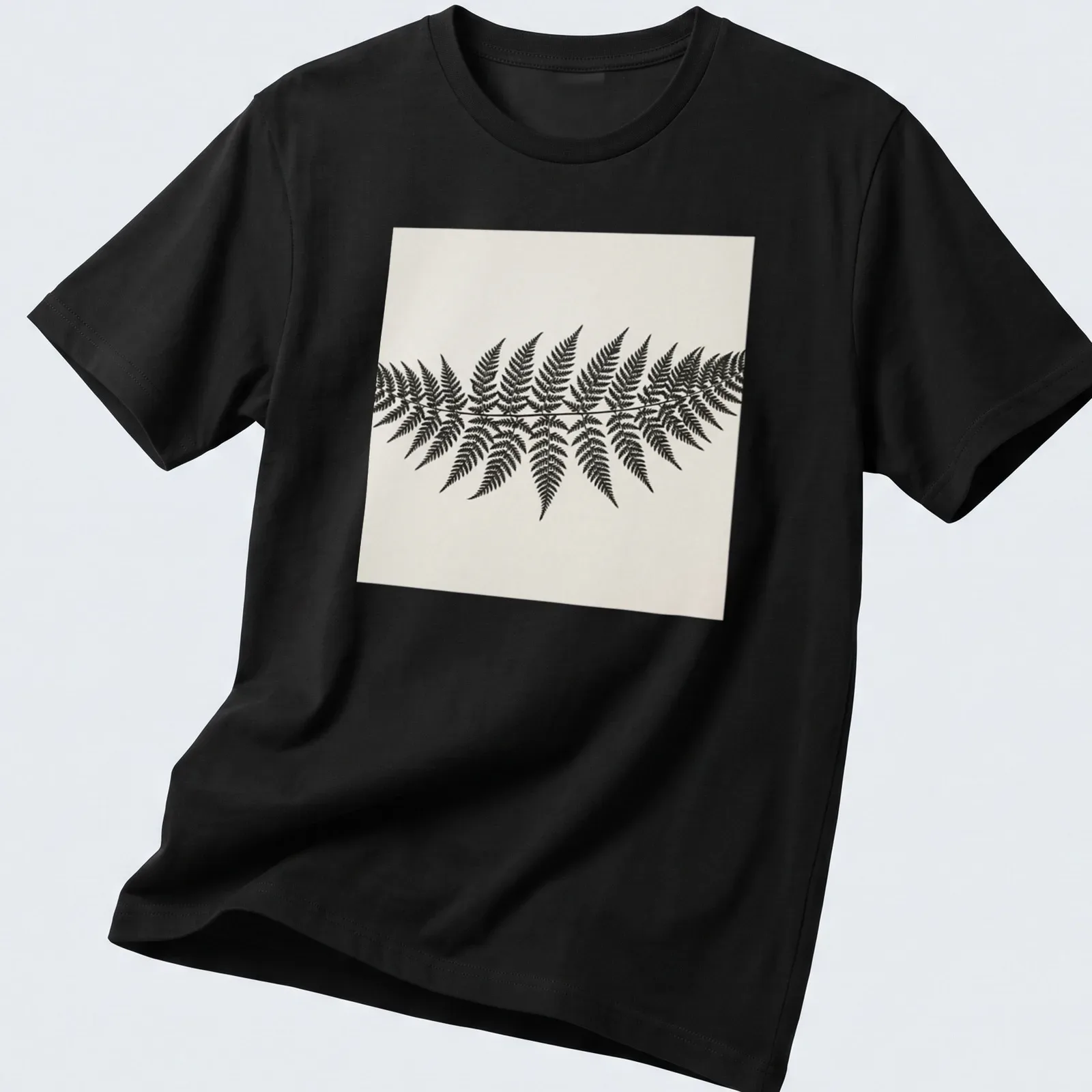 Botanical illustration of a fern frond in black and white — printed on a unisex t-shirt