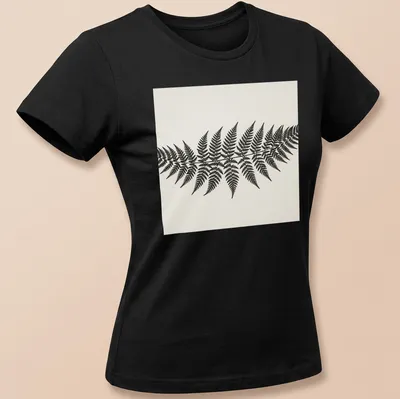 Botanical illustration of a fern frond in black and white — printed on a women's shirt