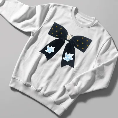 Cottagecore style t-shirt featuring a black velvet bow with heart and flowers — printed on a unisex sweatshirt