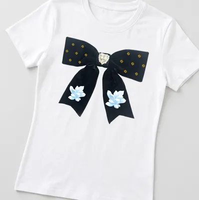 Cottagecore style t-shirt featuring a black velvet bow with heart and flowers — printed on a women's shirt