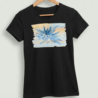 Watercolor botanical branch in blue, peach, and soft yellow on — printed on a women's shirt