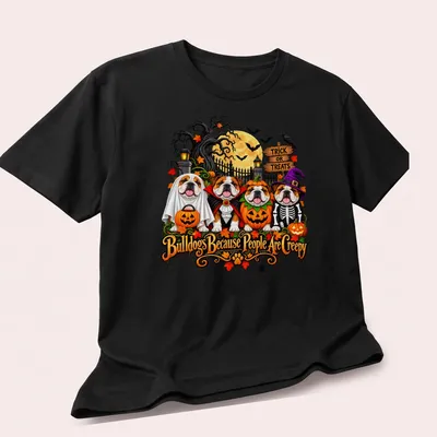 Colorful cartoon bulldogs in Halloween costumes with playful text — printed on a unisex t-shirt (angled view)