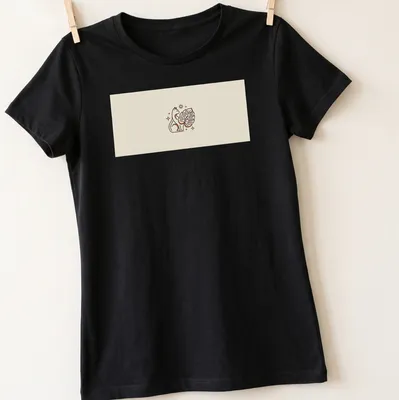 Minimalist monoline design of a cat intertwined with a monstera leaf — printed on a women's shirt
