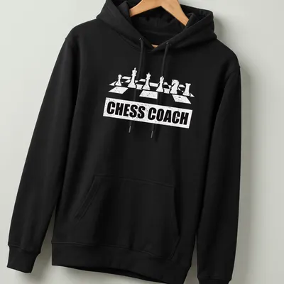 Bold Chess Coach t-shirt featuring chess pieces and simple typography — printed on a unisex hoodie