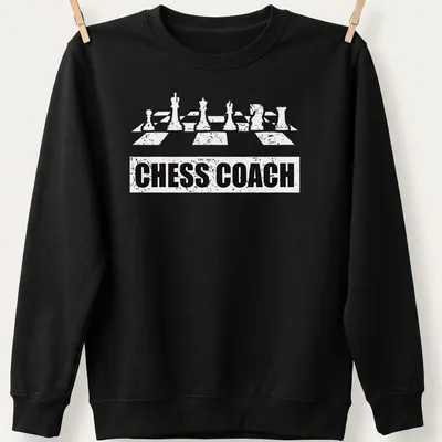 Bold Chess Coach t-shirt featuring chess pieces and simple typography — printed on a unisex sweatshirt