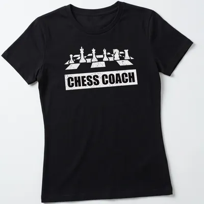 Bold Chess Coach t-shirt featuring chess pieces and simple typography — printed on a women's shirt