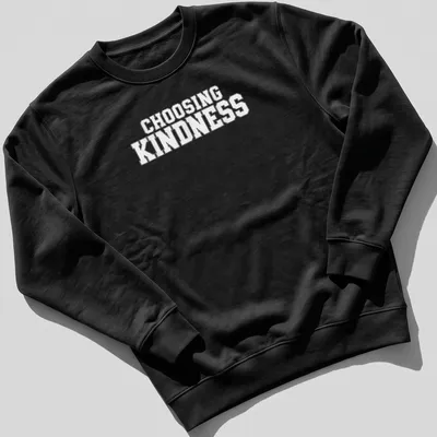 White t-shirt with bold text reading Choosing Kindness — printed on a unisex sweatshirt