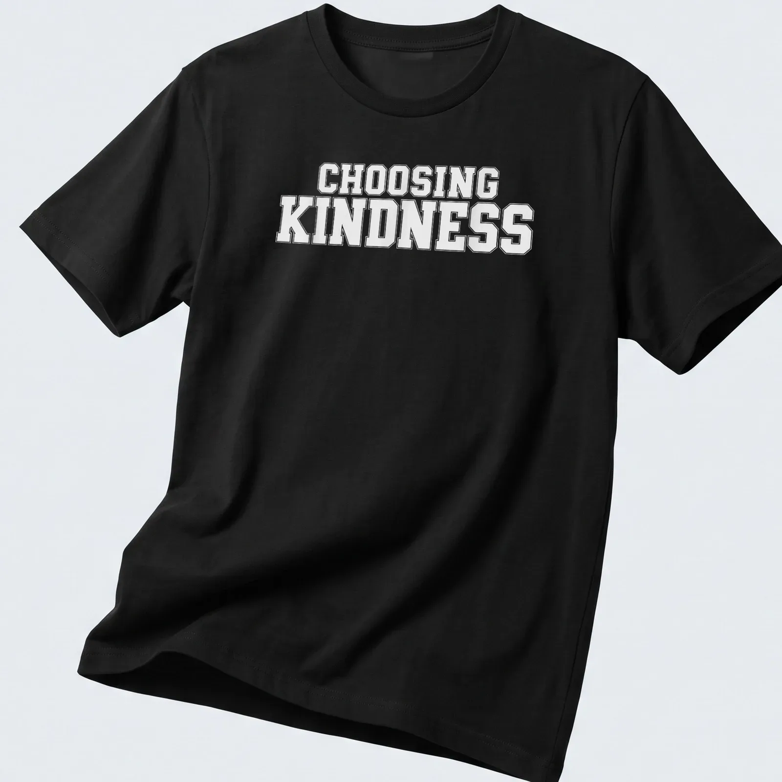 White t-shirt with bold text reading Choosing Kindness — printed on a unisex t-shirt