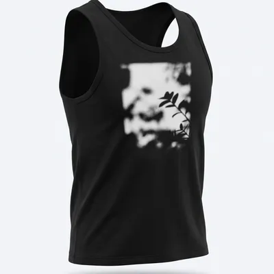 Cinematic blurred photo of a plant shadow in black, white, and green — printed on a tank top