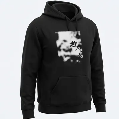 Cinematic blurred photo of a plant shadow in black, white, and green — printed on a unisex hoodie