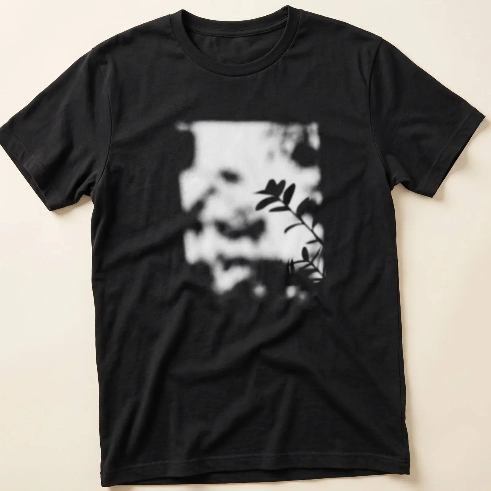Cinematic blurred photo of a plant shadow in black, white, and green — printed on a unisex t-shirt