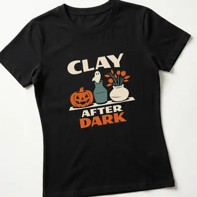 Retro design of a pumpkin and ghost with the text Clay After Dark for Halloween — printed on a women's shirt