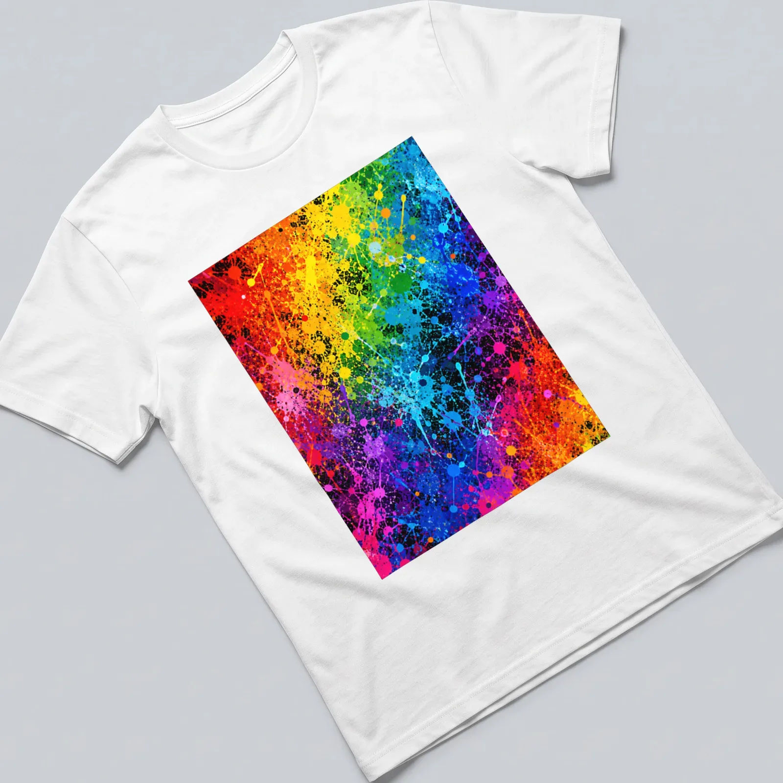 Abstract splatter paint graphic in vibrant colors of red, orange, yellow, green, blue, and purple. — printed on a unisex t-shirt
