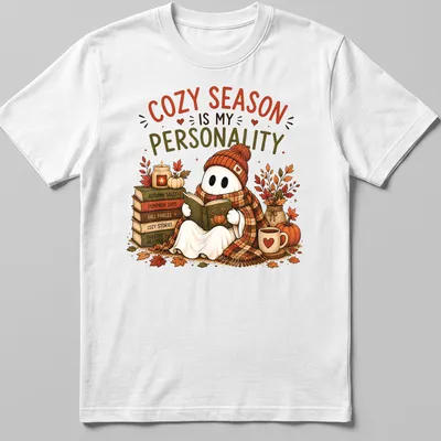 Whimsical illustration of a cute ghost reading with cozy season text