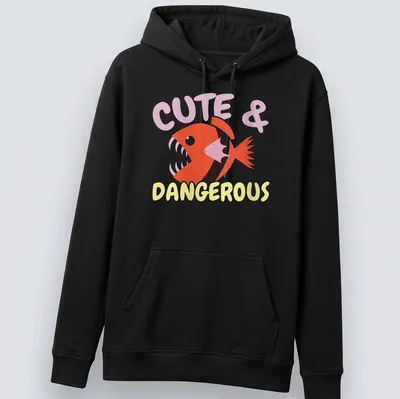 Playful cartoon piranha with vibrant colors and text Cute & Dangerous above it. — printed on a unisex hoodie