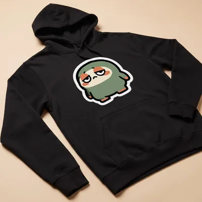 Flat design of a cute green blob monster with large eyes and a smile. — printed on a unisex hoodie