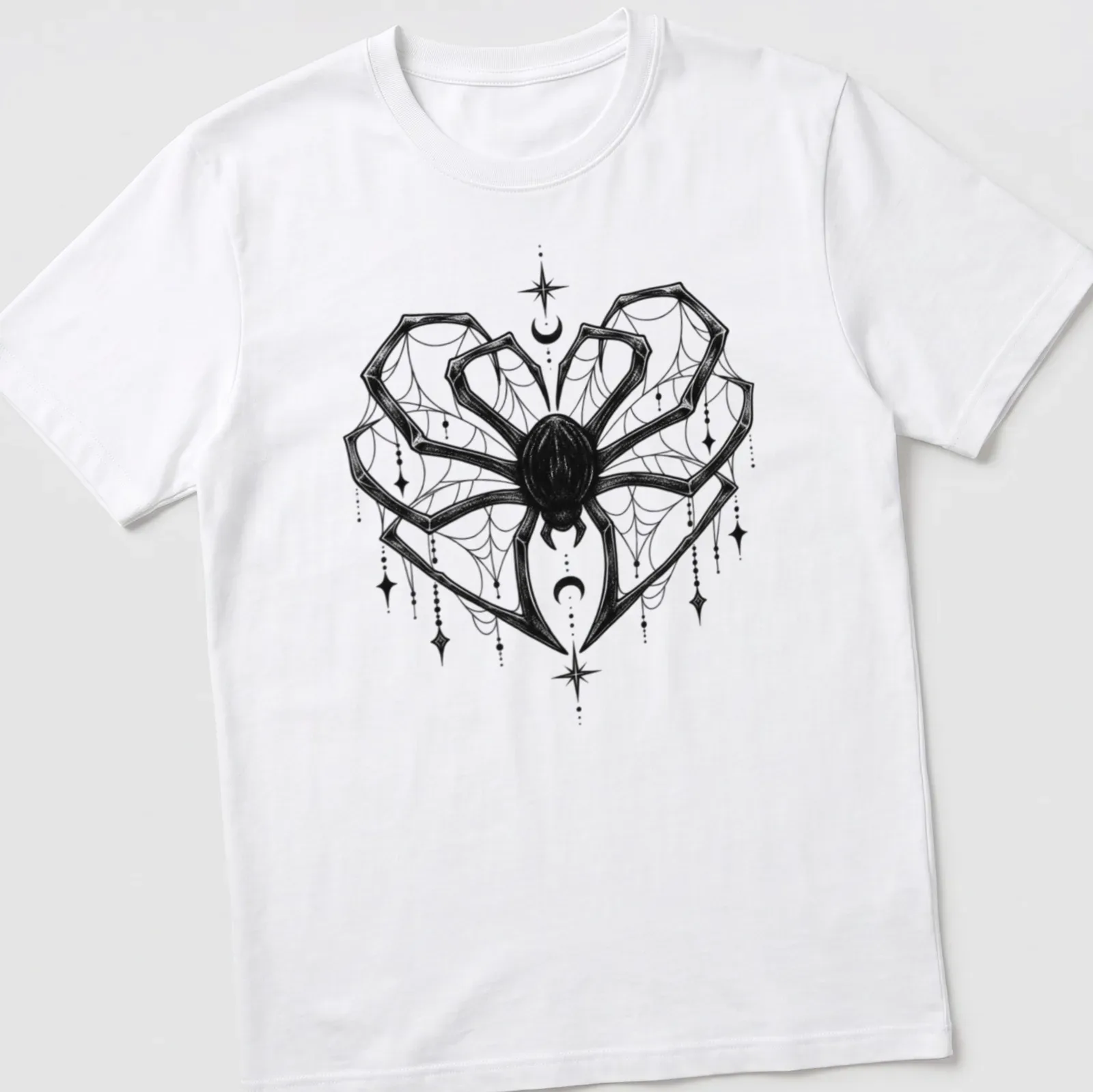 Black line art of a spider in a heart shape with celestial elements — printed on a unisex t-shirt