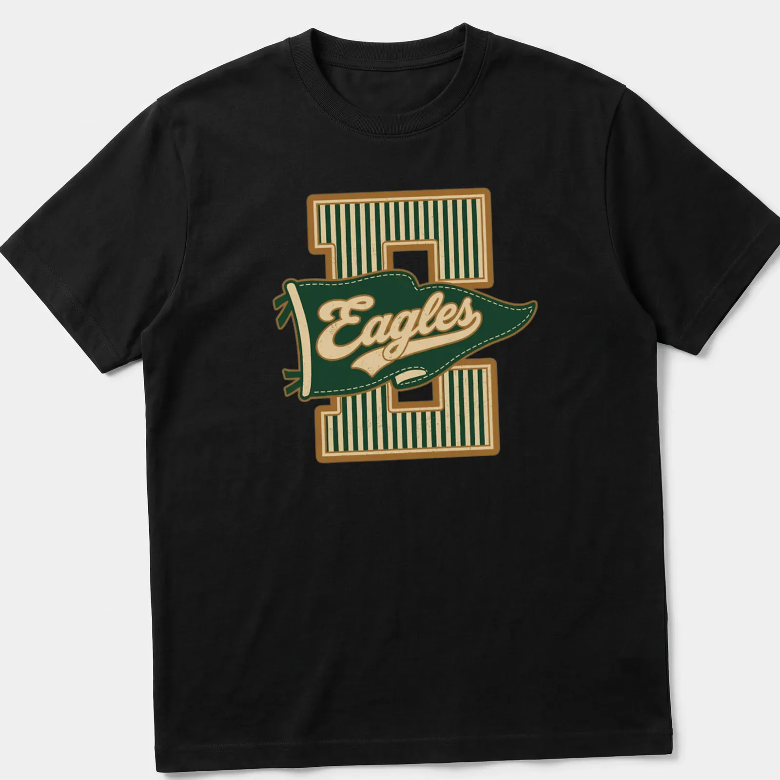 Retro pennant design featuring the word Eagles in green, gold, and cream — printed on a unisex t-shirt