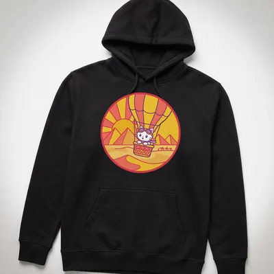 Kawaii style design of a cat in a hot air balloon surrounded by a colorful landscape — printed on a unisex hoodie