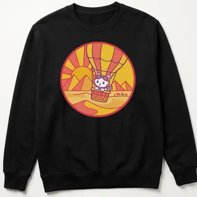 Kawaii style design of a cat in a hot air balloon surrounded by a colorful landscape — printed on a unisex sweatshirt