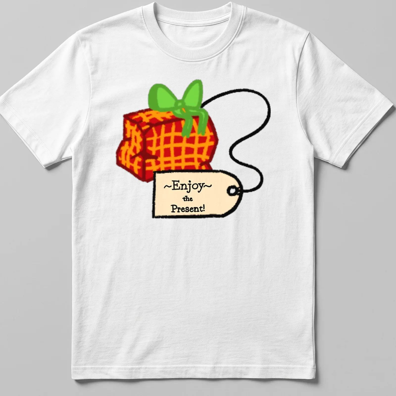Playful cartoon gift box with colorful accents and the phrase ~Enjoy~ the Present! — printed on a unisex t-shirt