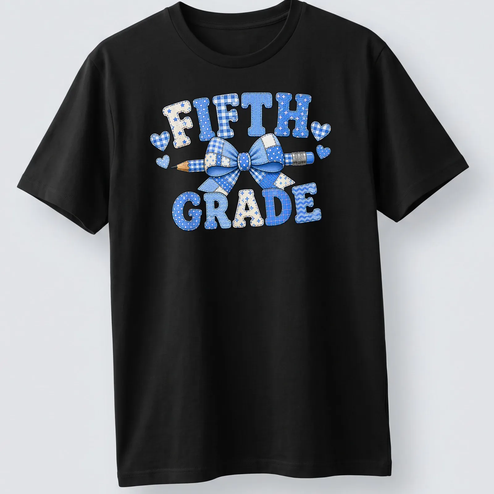 Patchwork design featuring a blue bow and pencil with 'Fifth Grade' text — printed on a unisex t-shirt