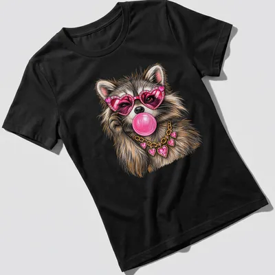 Colorful illustration of a raccoon wearing heart sunglasses and blowing bubblegum — printed on a women's shirt
