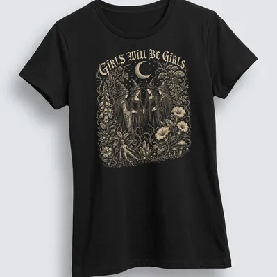 Vintage illustration of four witches with the text 'Girls Will Be Girls' in gold, white, and black — printed on a women's shirt