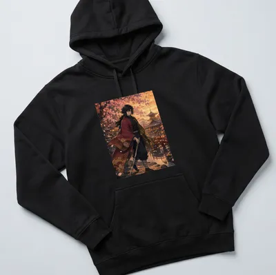 Anime-inspired t-shirt featuring Giyu Tomioka against a sunset with colors pink, orange, and green — printed on a unisex hoodie