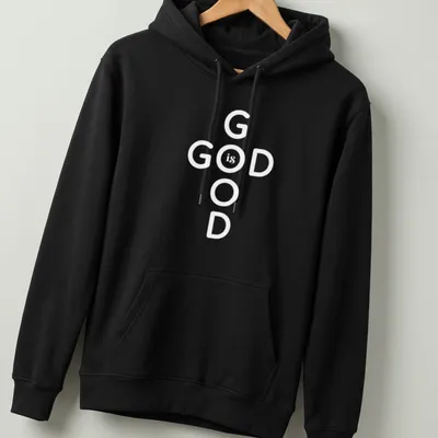 Bold typography T-shirt displaying 'God Is Good' Christian message in black and white — printed on a unisex hoodie
