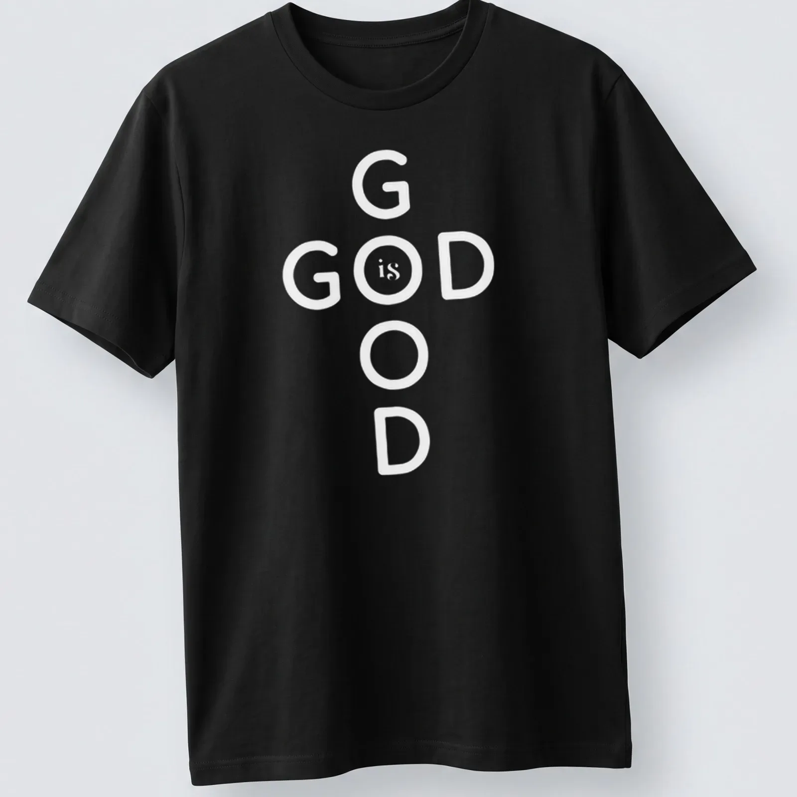 Bold typography T-shirt displaying 'God Is Good' Christian message in black and white — printed on a unisex t-shirt