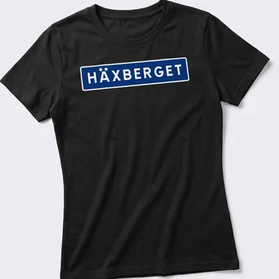 Simple modern HÄXBERGET shirt with bold blue and white lettering — printed on a women's shirt
