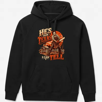 Leatherface with chainsaw t-shirt featuring vintage horror style and bold text — printed on a unisex hoodie