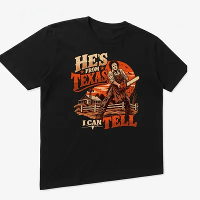 Leatherface with chainsaw t-shirt featuring vintage horror style and bold text — printed on a unisex t-shirt (angled view)