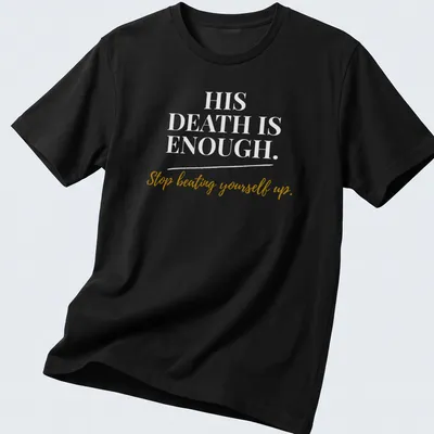 Inspirational typography shirt with gold and white text encouraging self-compassion and faith.
